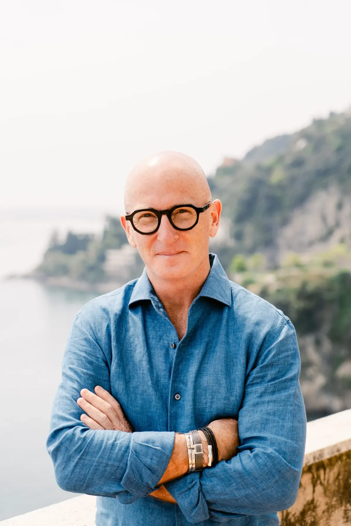 Coastal portrait, blue-grey linen, golden hour.